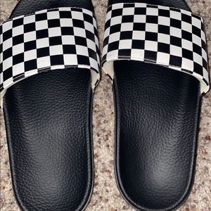 Black and white checkered vans slides